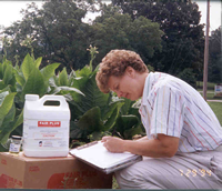 woman recording chemicals